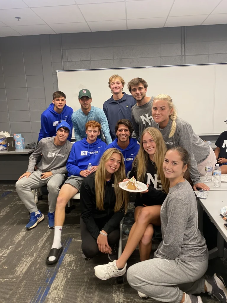 College tennis players from the University of North Georgia celebrating a birthday.