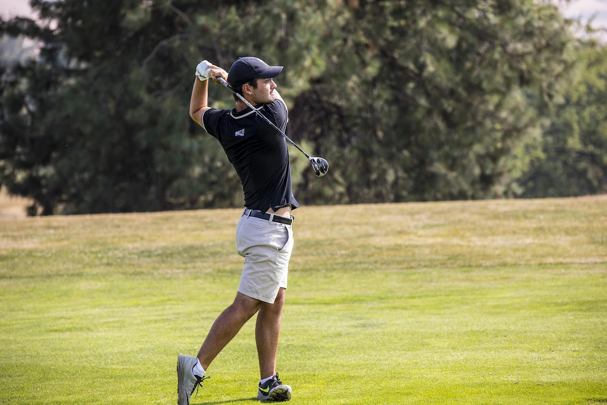 College golf player Enrique Marin competing for her university