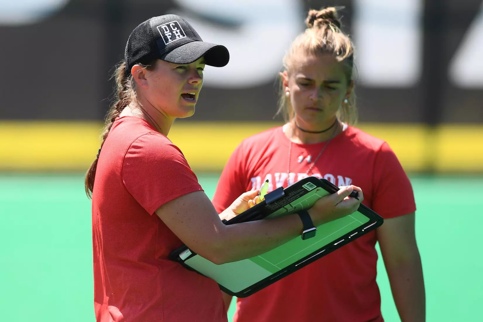 Coach Zoe Almquist talking to an athlete